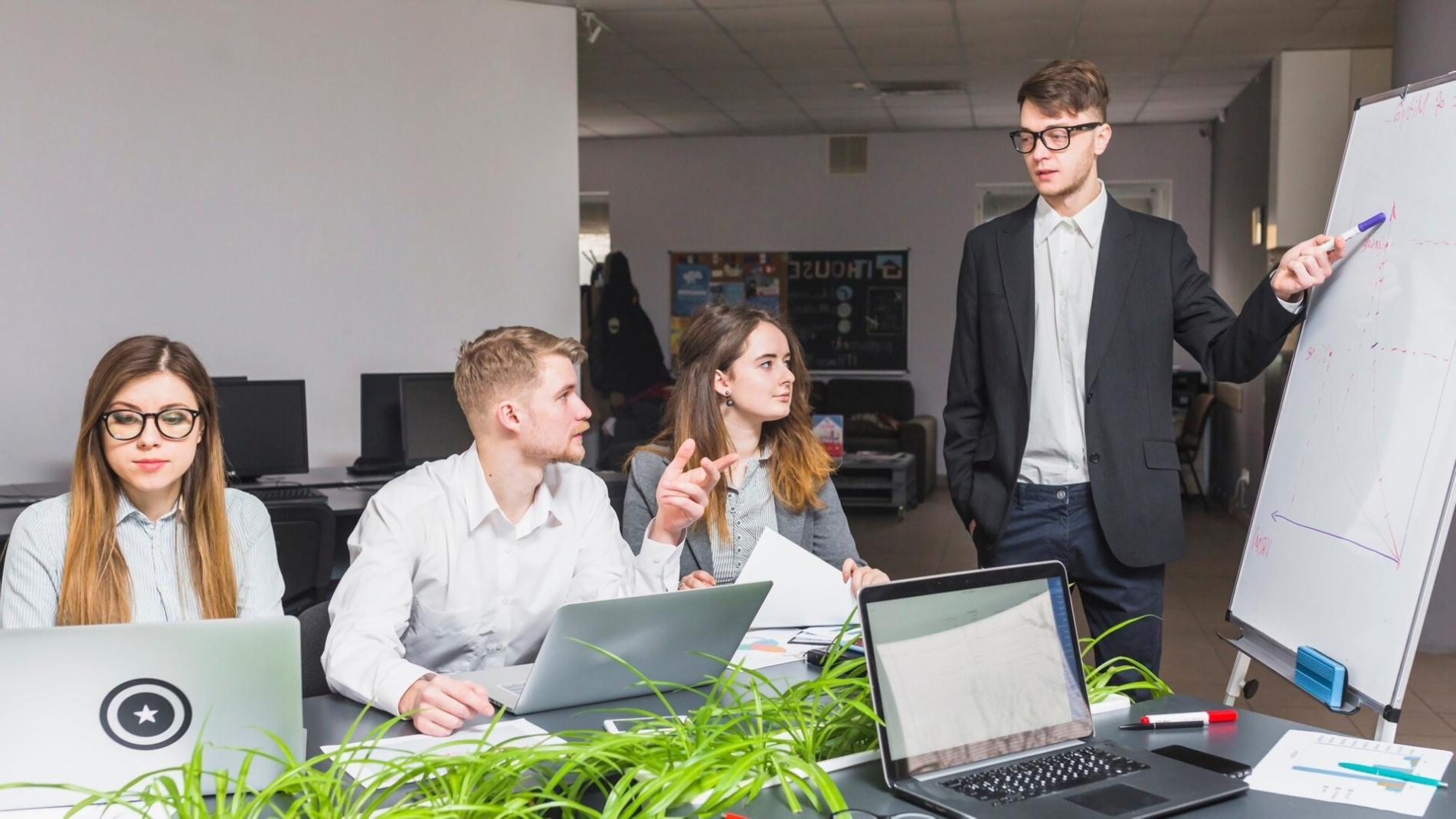 Students analyzing financial charts in collaborative learning environment